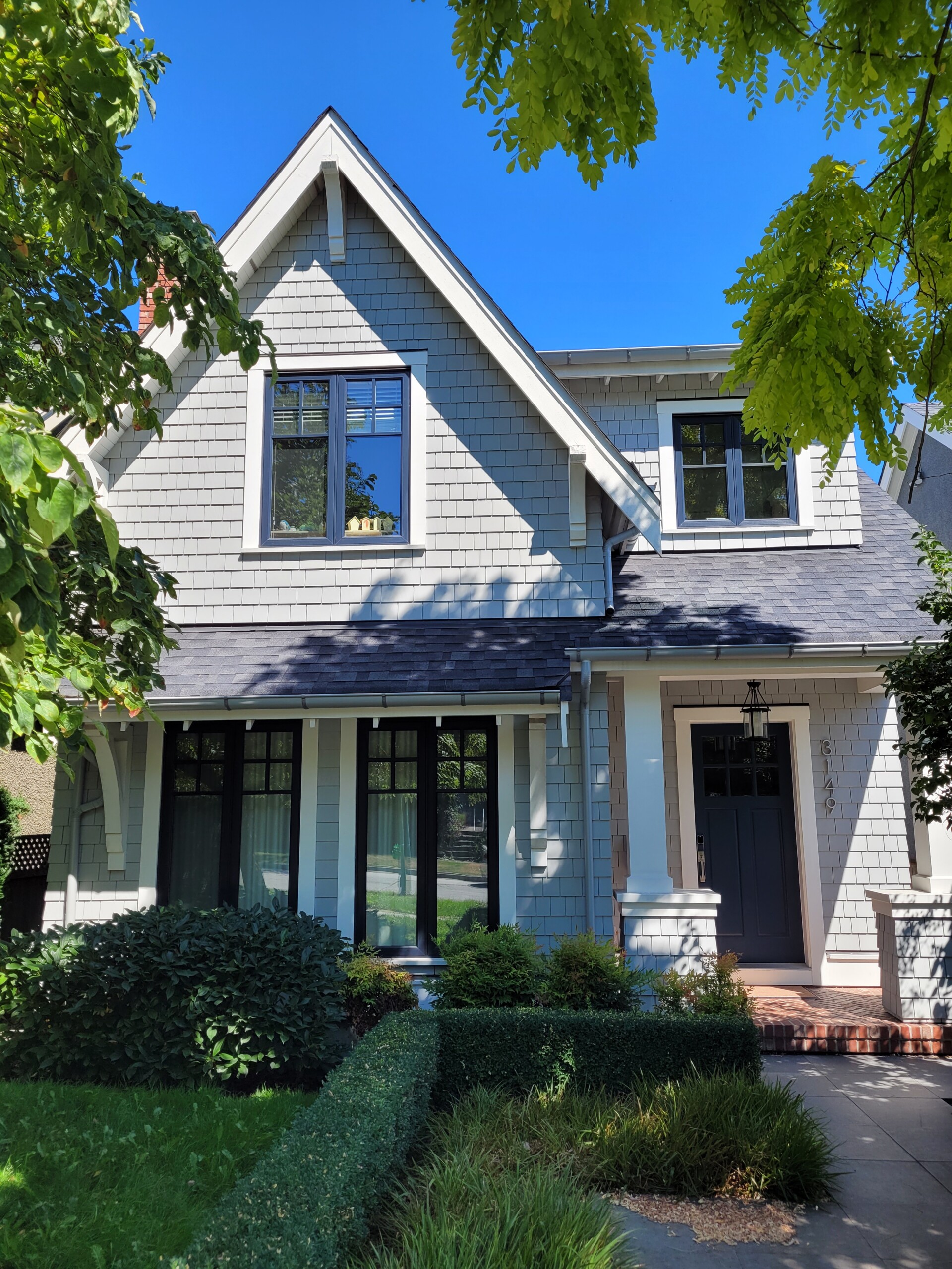 House with peeling paint and faded exterior in Surrey, ready for repainting